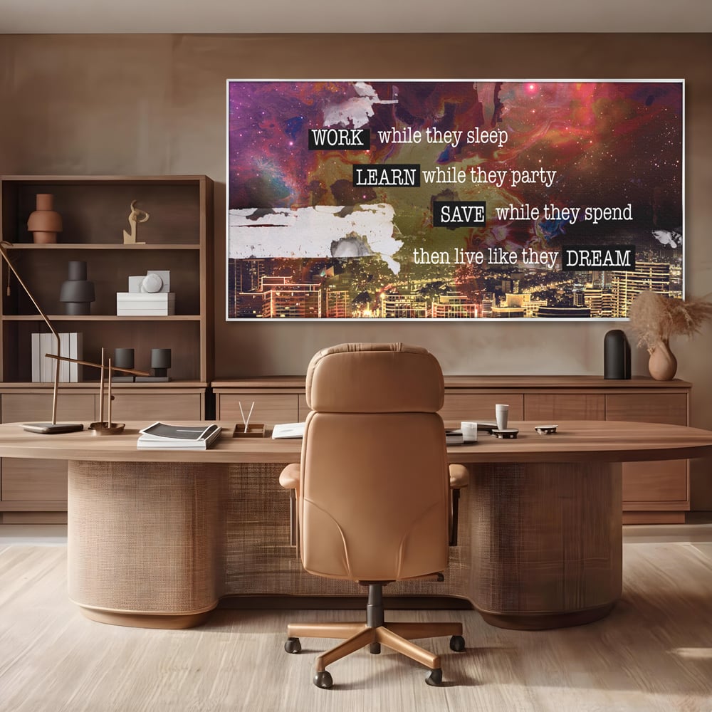 Tablou canvas cu tablou motivational cu oras si cer cosmic, in rama de aluminiu argintiu, pe perete intr-un birou